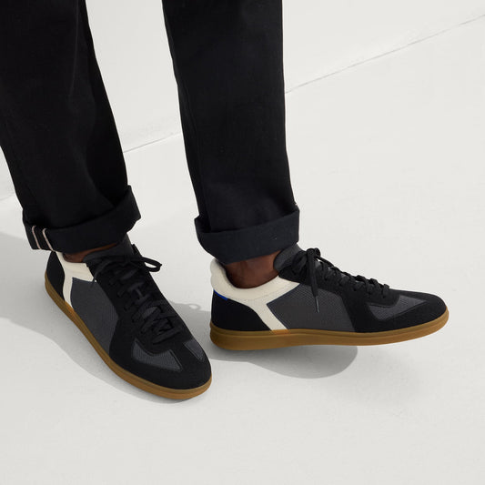 hover | Model wearing The RS01 Sneaker in Obsidian Black.