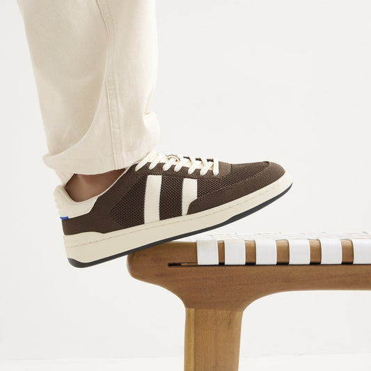 hover | Model wearing The Men's Court Sneaker in Dugout.