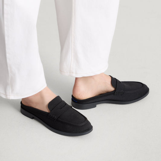 hover | Model wearing The Penny Loafer Mule in Black.