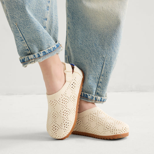 hover | A child wearing The Kids Clog in White Crochet.