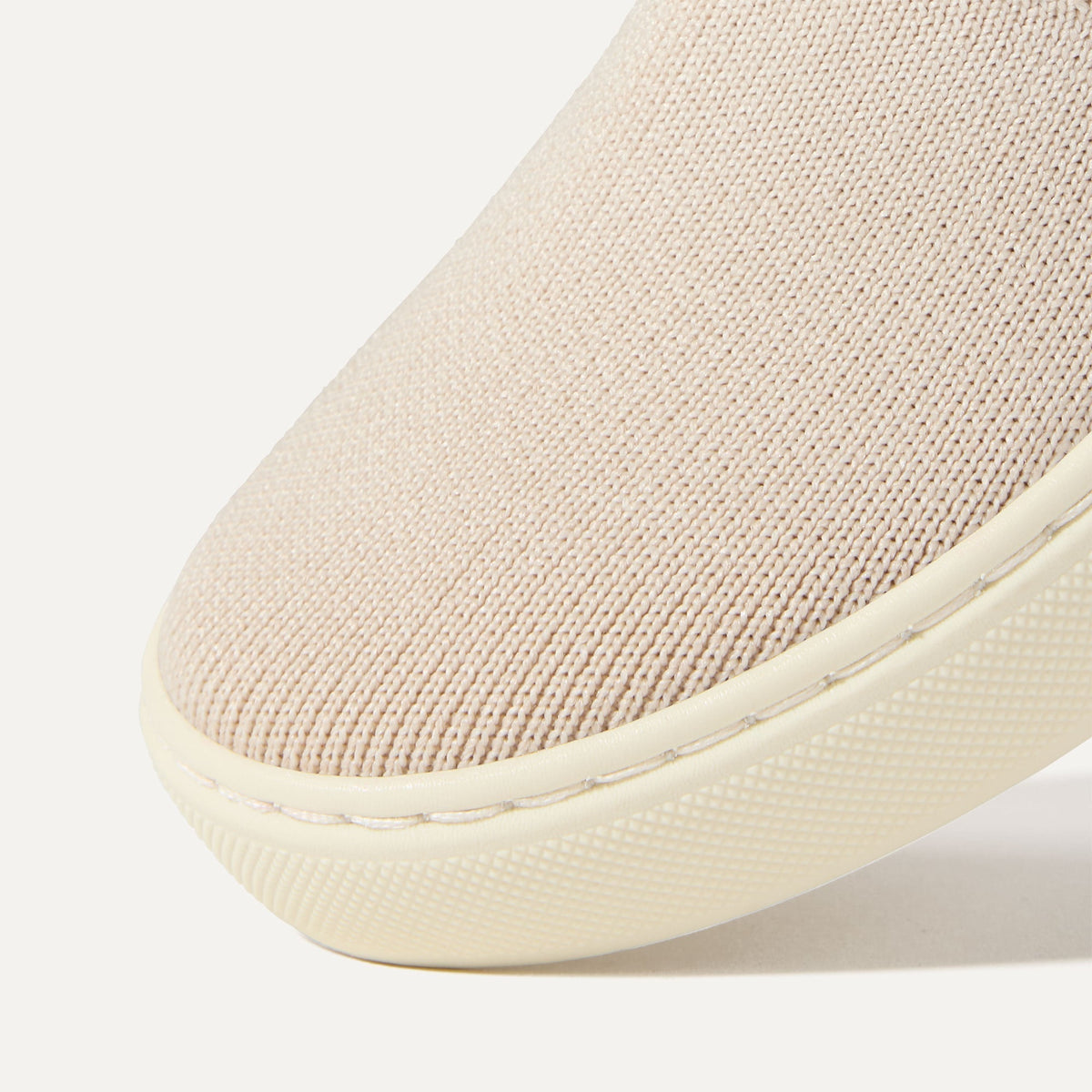 Close up of the toe and vamp of The Kids Sneaker in Sand.
