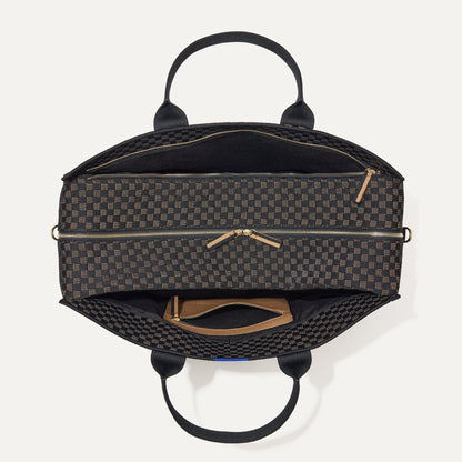 The Weekender in Night Song shown from the top with zipper side compartment and magnetic side compartment open.