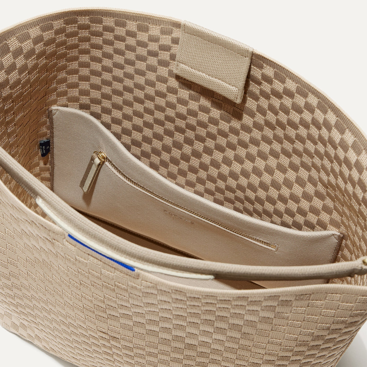 The Bucket Bag in Knot Brown close up of interior zipper pocket.