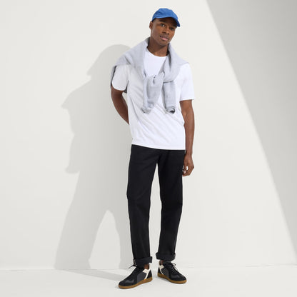 model | Alternate view of a model wearing The RS01 Sneaker in Obsidian Black.
