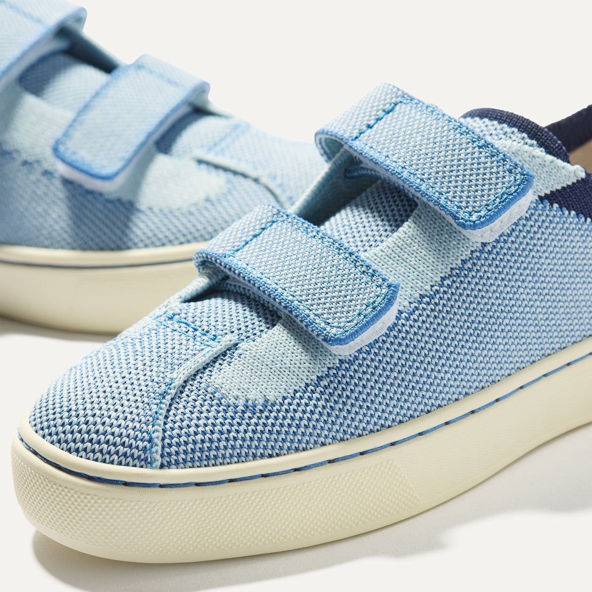 Close up of the vamp of The Kids Strap Sneaker in Berry Blue.