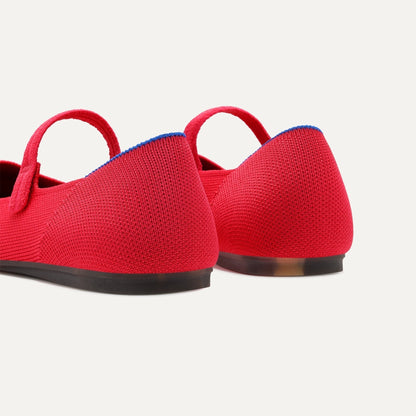 Close up of the heel of The Square Mary Jane in Lollipop, with Rothy's signature blue halo.