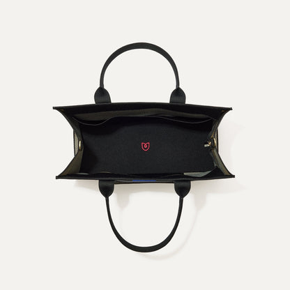 The Classic Tote in Black Herringbone, shown from above, with the interior exposed.