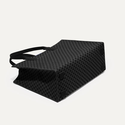 The Classic Tote in Black Sand, shown from the bottom.