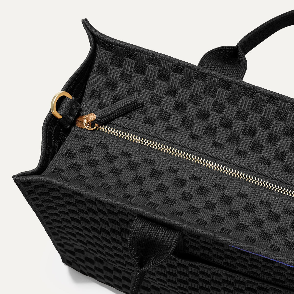 The Classic Tote in Black Sand, shown from above, with the top zipper closed.