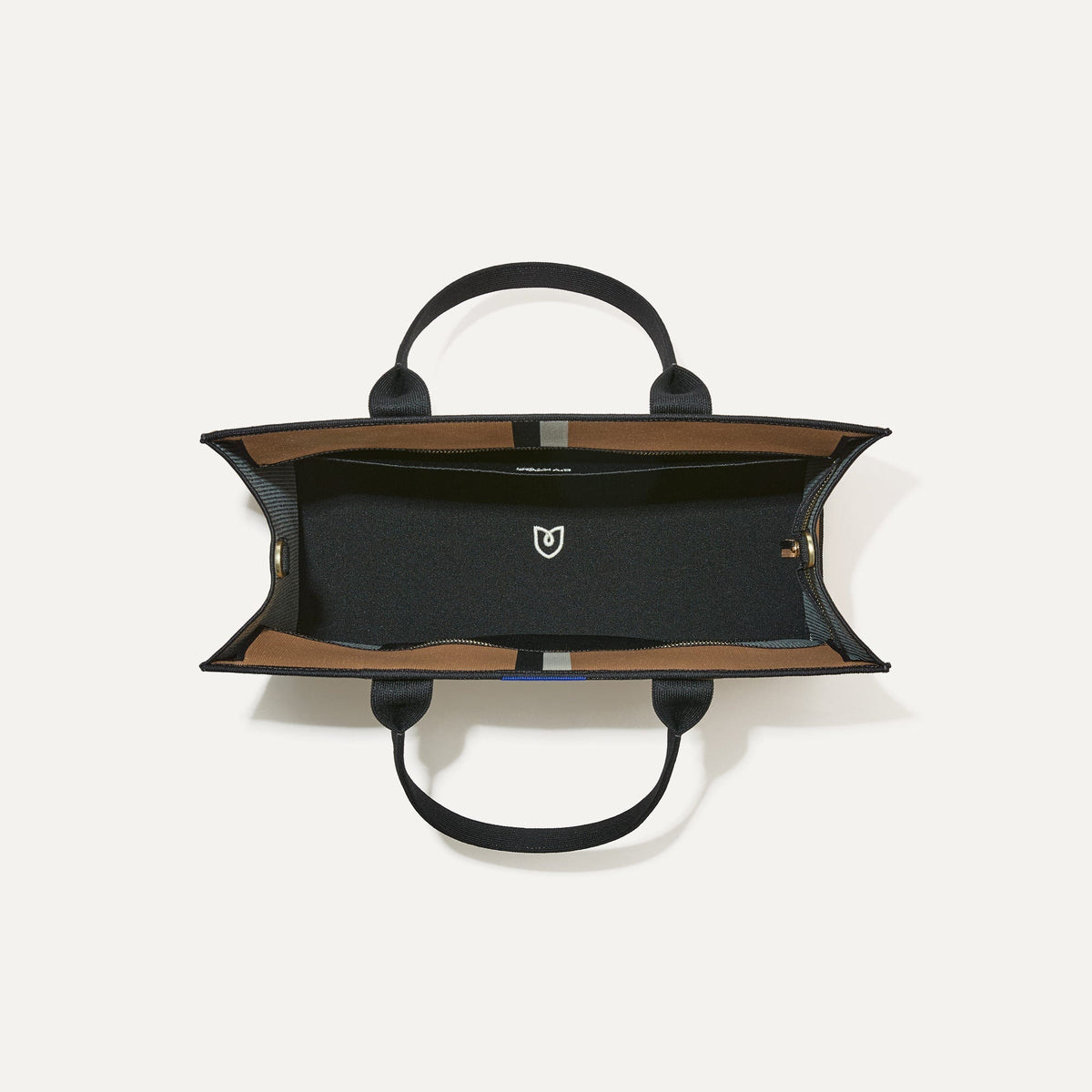 The Classic Tote in Grand Piano, shown from above, with the interior exposed.