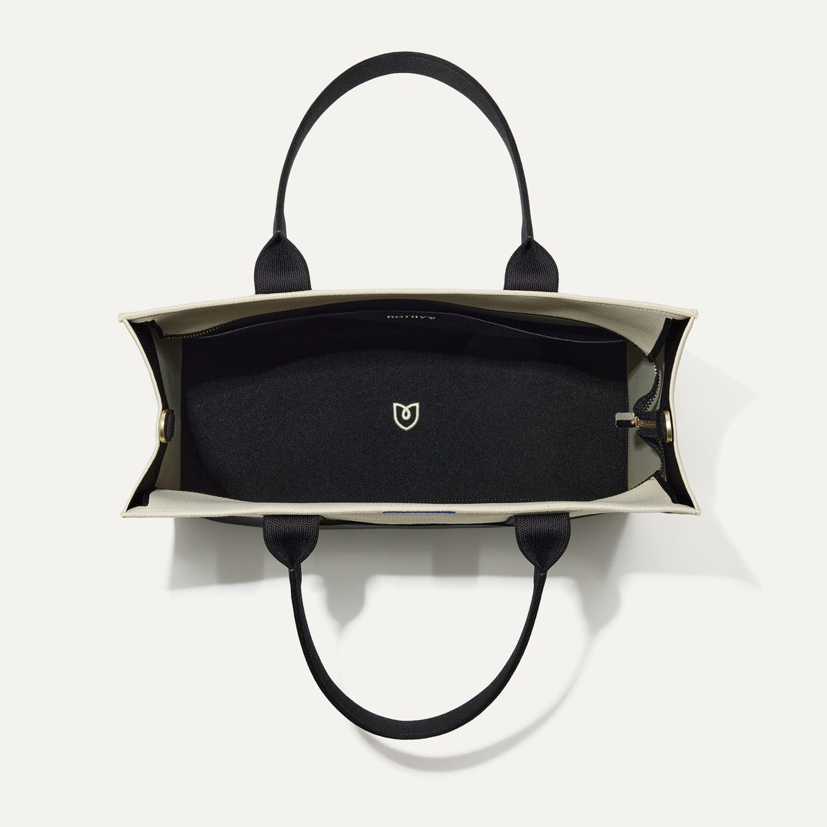 The Classic Tote in Luna, shown from above, with the interior exposed.