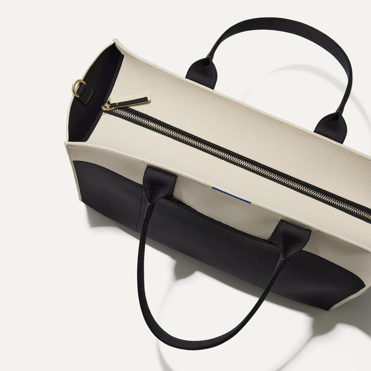 The Classic Tote in Luna, shown from above, with the top zipper closed.