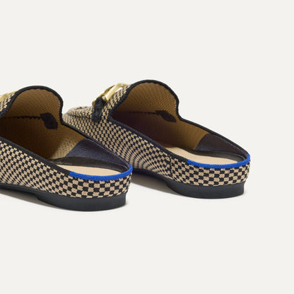 Close up of the heel of The Double Bit Loafer Mule in Classic Micro Check, with Rothy's signature blue halo.