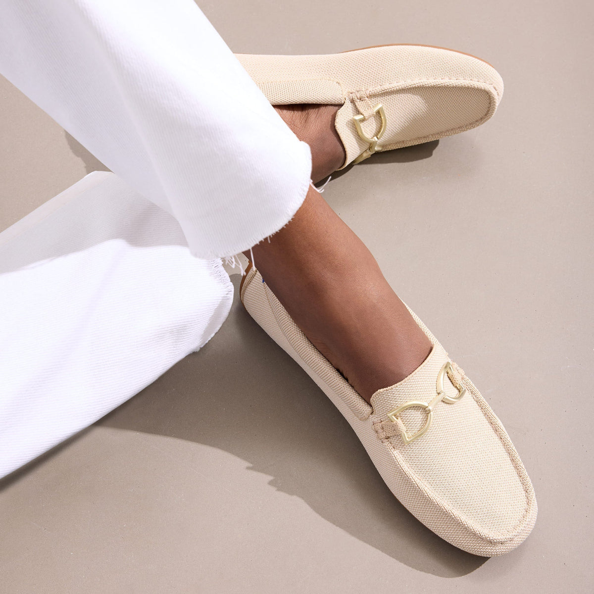 hover | Model wearing The Double Bit Driver in Sesame.