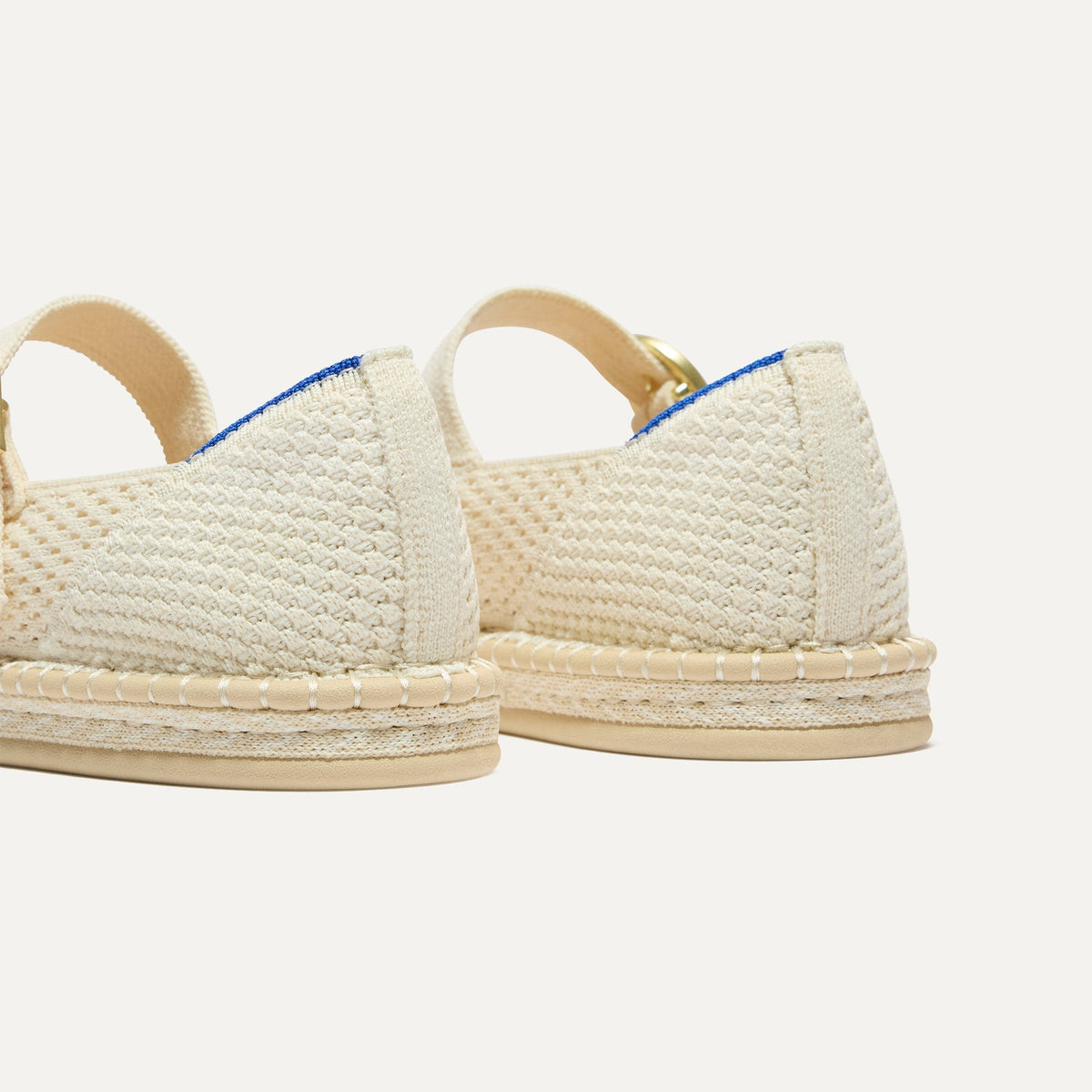 Close up of the heel of The Espadrille Mary Jane in Jasmine, with Rothy's signature blue halo.