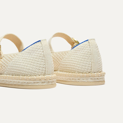 Close up of the heel of The Espadrille Mary Jane in Jasmine, with Rothy's signature blue halo.