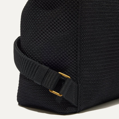 Closer look at the side straps of The Cinch Back Pack in Black.