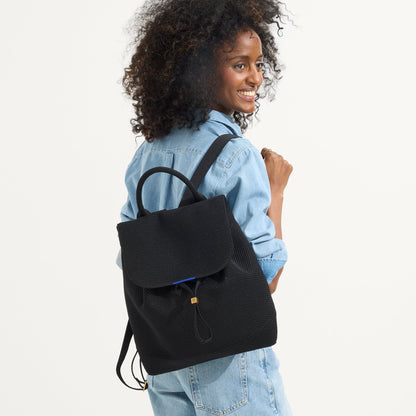 hover | The Cinch Back Pack in Black shown on model.
