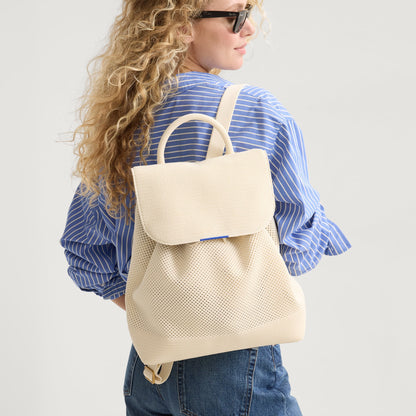 hover | Model wearing The Cinch Backpack in Coconut Crochet.