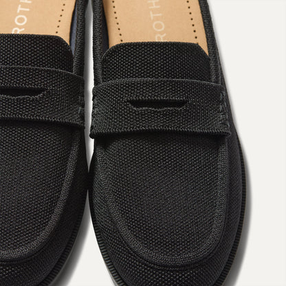 Close up of the toe and vamp of The Penny Loafer Mule in Black, showing the penny keeper detail.