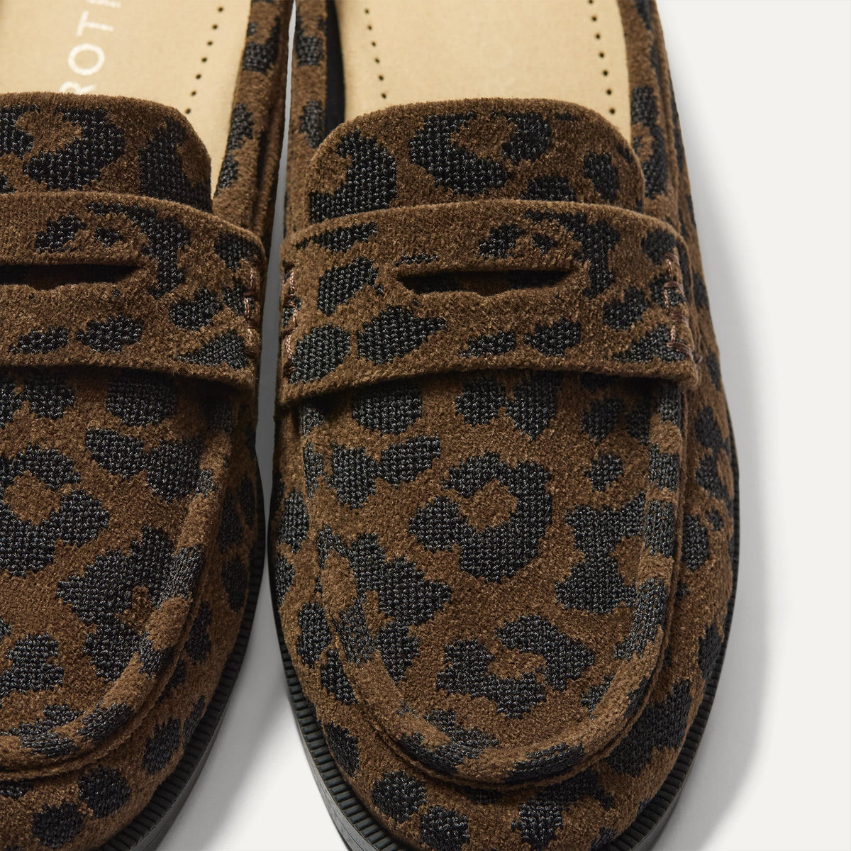 Close up of the toe and vamp of The Penny Loafer Mule in ReVelvet Cheetah, showing the penny keeper detail.