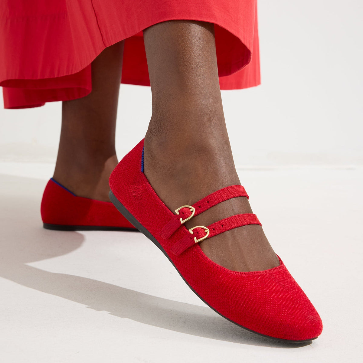 hover | Model wearing The Double Buckle Mary Jane in ReVelvet™ Red Crisp.