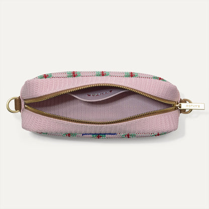 The Crossbody Camera Bag in Watermelon Market Stripe, shown from above, with the interior exposed.