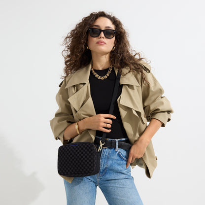 hover | The Crossbody Camera Bag in Black Sand worn as a crossbody by a model.