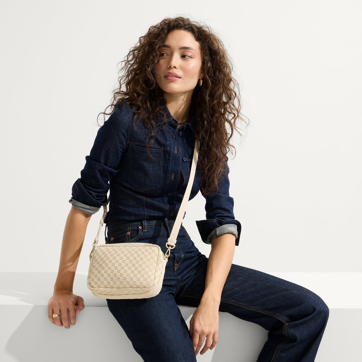 hover | The Crossbody Camera Bag in Sesame worn as a crossbody by a model.