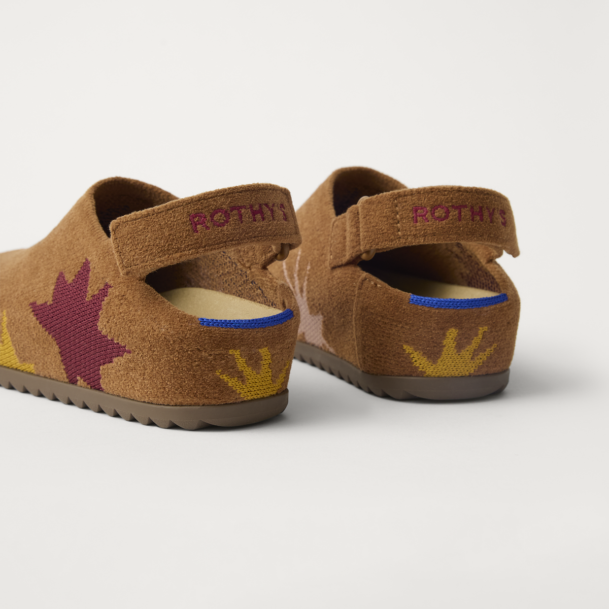 The Kids Clog in ReVelvet™ Butterscotch Burst shown from the back view with the heel detail.
