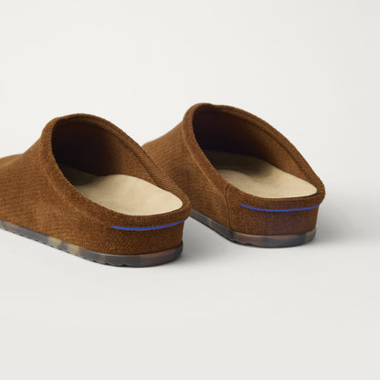Close up of the heel of The Casual Clog in ReVelvet™ Russet, with Rothy's signature blue halo.