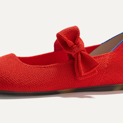 Close up of the bow detail of The Kids Tux Bow Mary Jane in Bright Red.