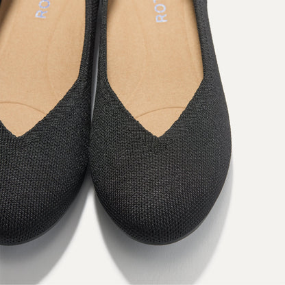 Close up of the toe and vamp of The Daily Flat in Black.