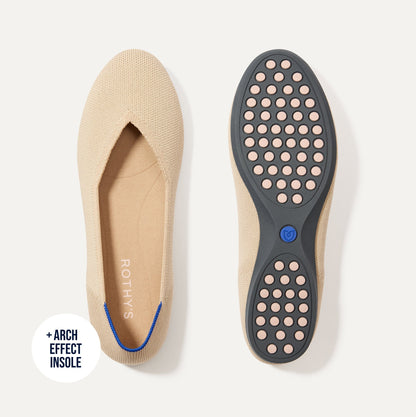 PDP |The Daily Flat in Ecru shown from the top with one shoe showing the outsole.