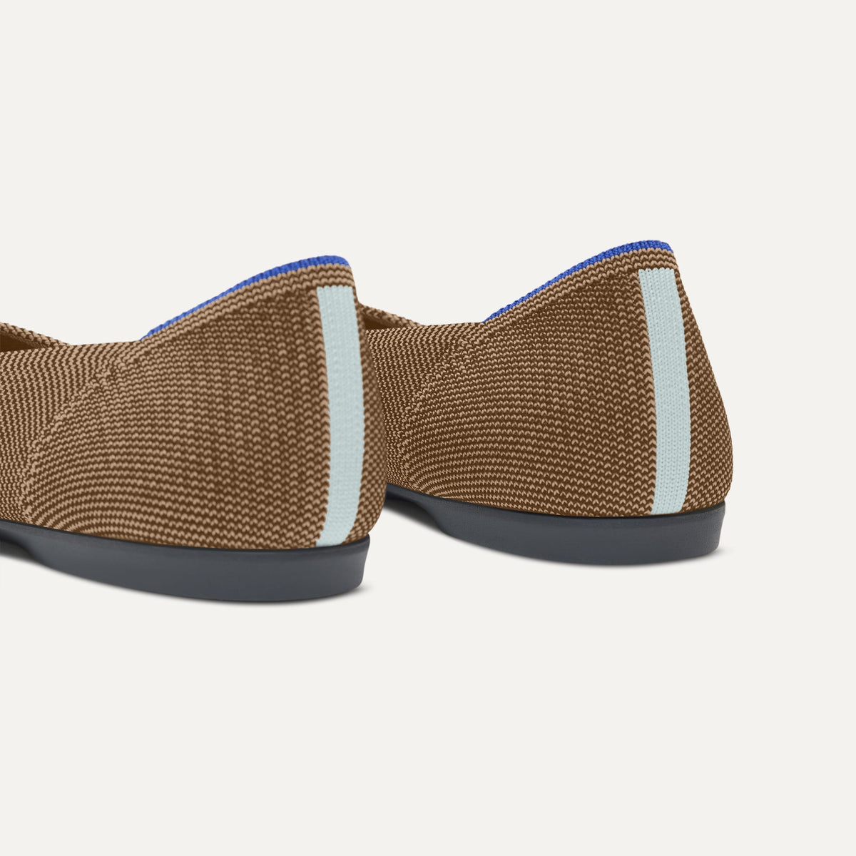 Close up of the heel of The Daily Flat in Minx, with Rothy's signature blue halo.