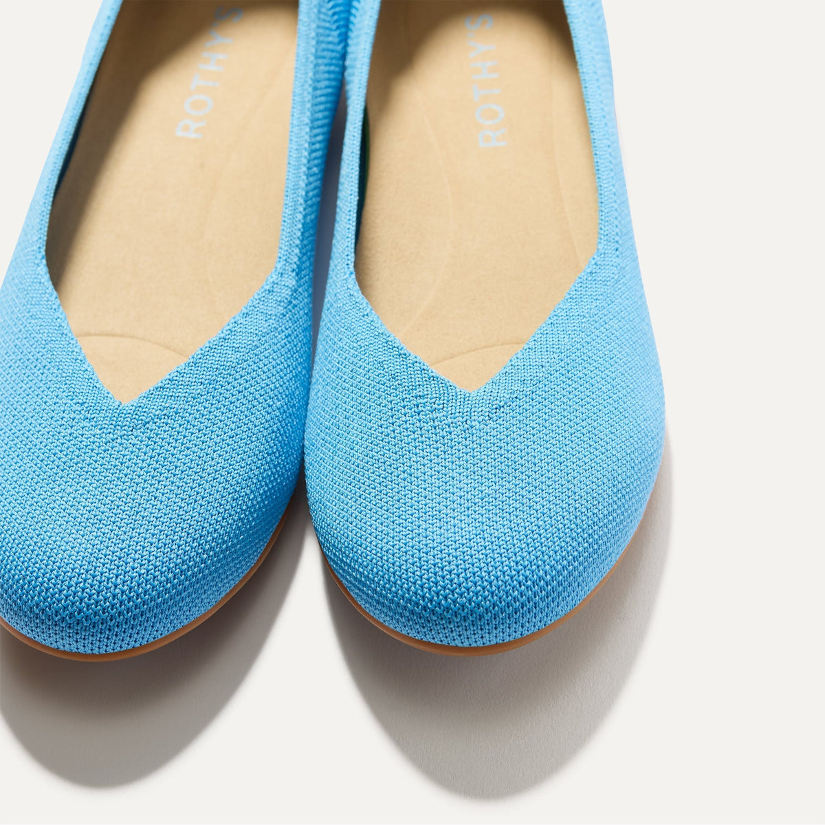 Close up of the toe and vamp of The Daily Flat in Robin Blue.