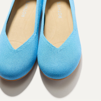 Close up of the toe and vamp of The Daily Flat in Robin Blue.