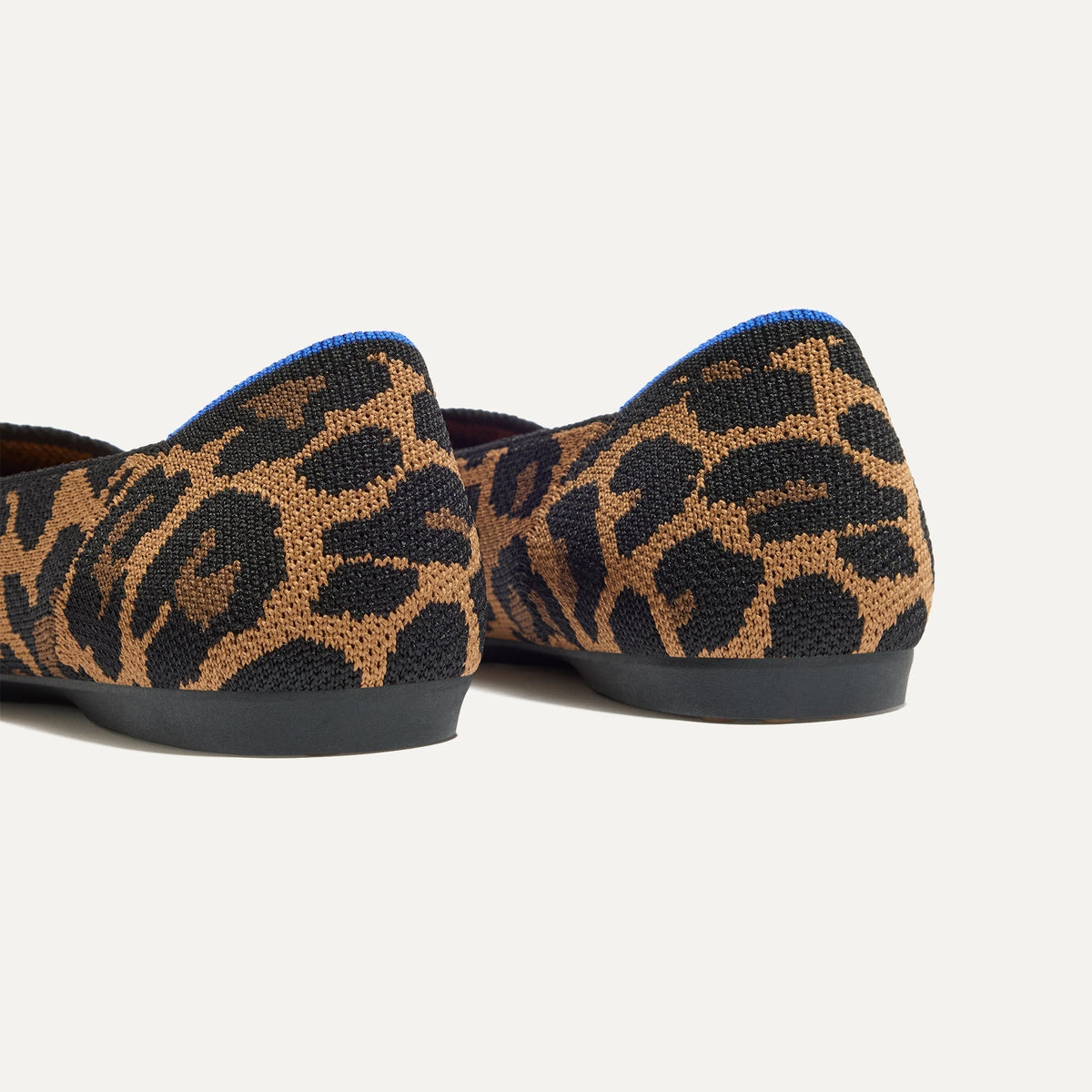 Close up of the heel of The Daily Flat in Sable Spot, with Rothy's signature blue halo.