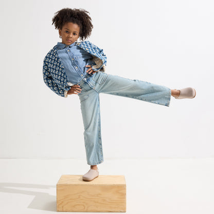 model | Alternate view of a child wearing The Kids Clog in Dove.