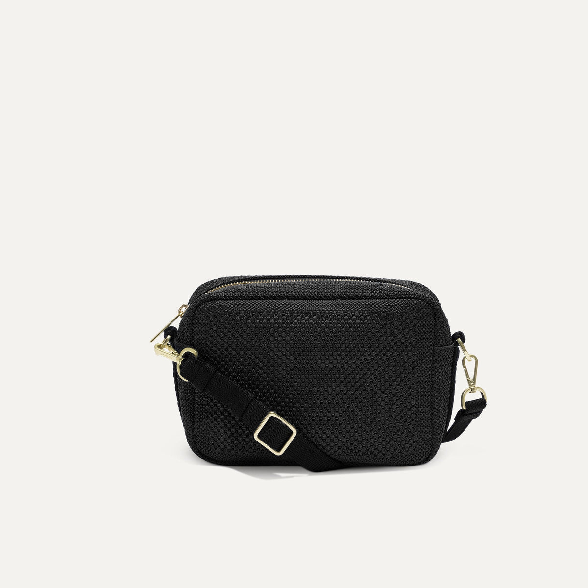 PLP |The Crossbody Camera Bag in Black Licorice Open-Knit, shown from the front.