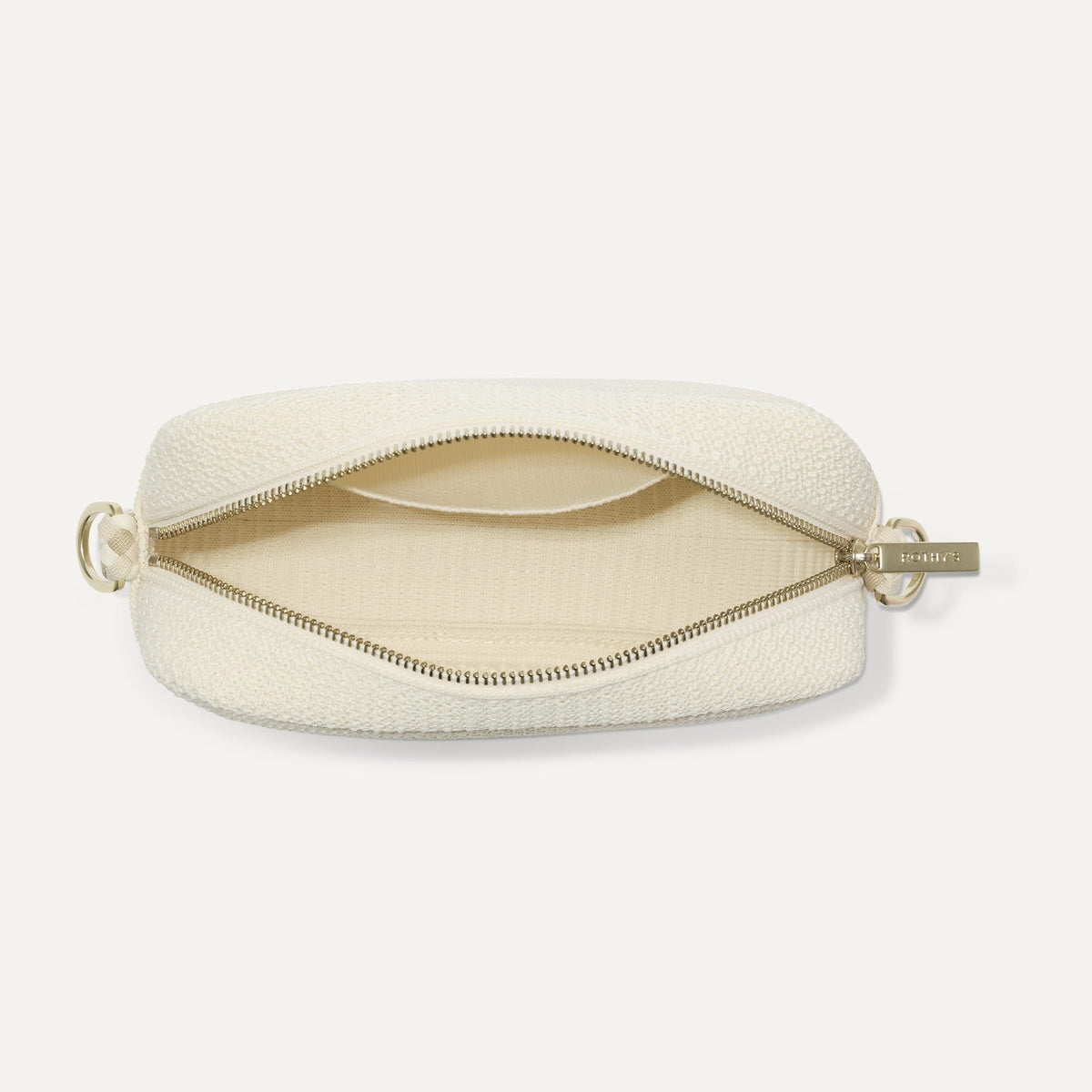 The Crossbody Camera Bag in Cream Twist Open-Knit, shown from above, with the interior exposed.