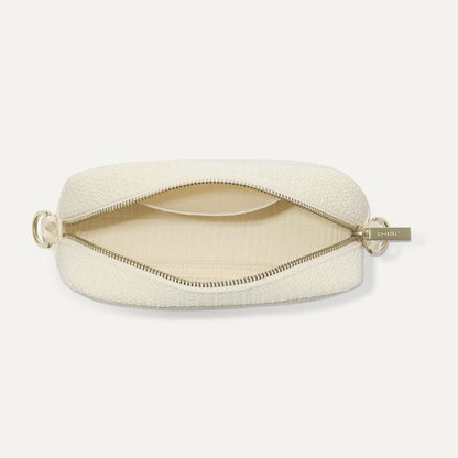 The Crossbody Camera Bag in Cream Twist Open-Knit, shown from above, with the interior exposed.