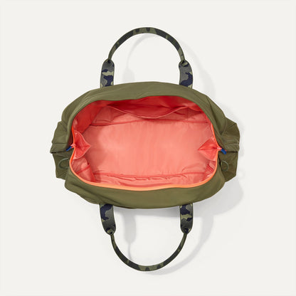 The Travel Duffle in Forest shown open from the top.