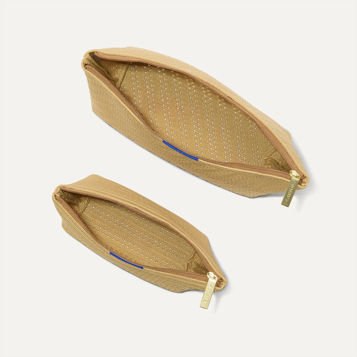 The Travel Pouch Set in Brown Butter Crochet shown from the top with zipper closure open.