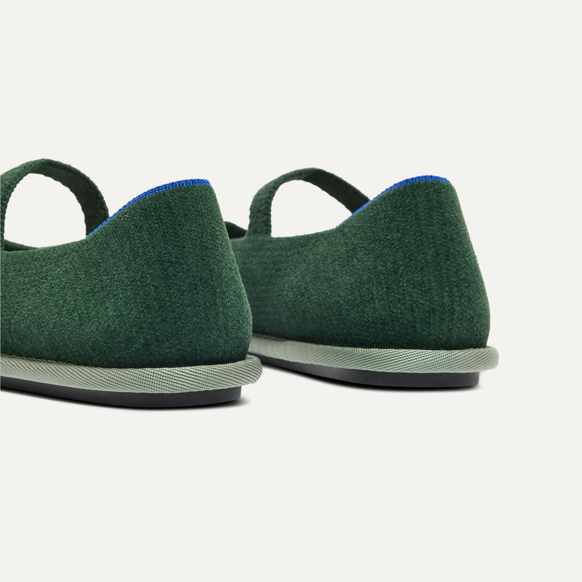 Close up of the heel of The Cruiser Mary Jane in ReVelvet Woodland, with Rothy's signature blue halo.