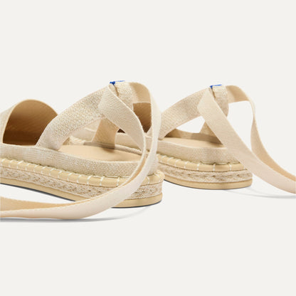Close up of the heel of The D'Orsay Espadrille in Seashell, showing removable ankle straps.