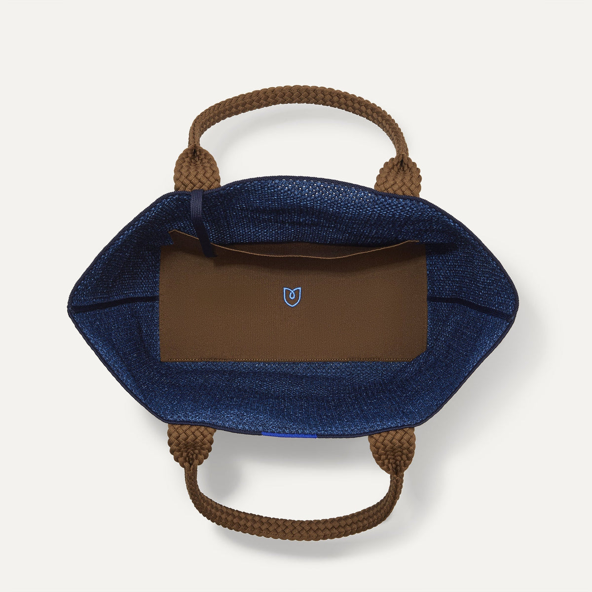 The Lightweight Tote in Dusk Open-Knit shown open from the top, with interior visible.