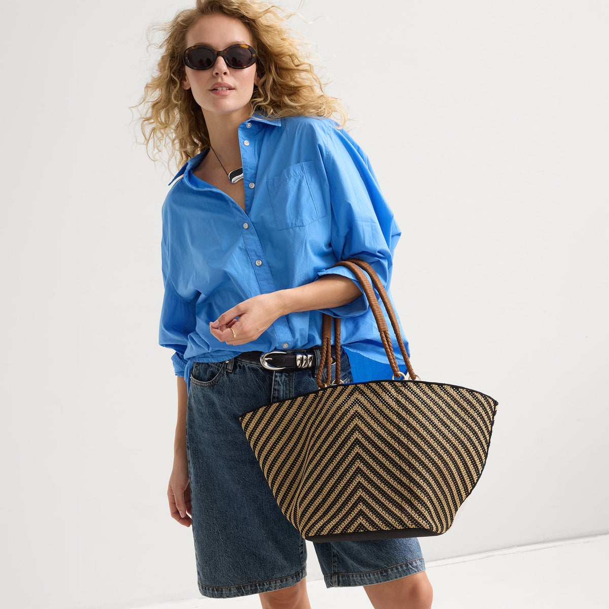 hover |Model shown holding The Summer Tote in Toffee Chevron shown from the front.