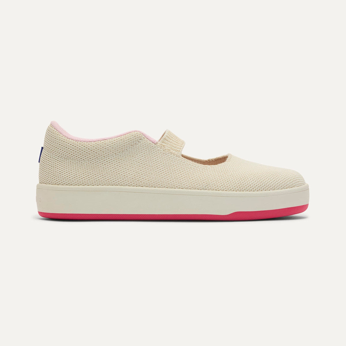 side | The Kids MJ Sneaker in Cream Puff shown from the side.