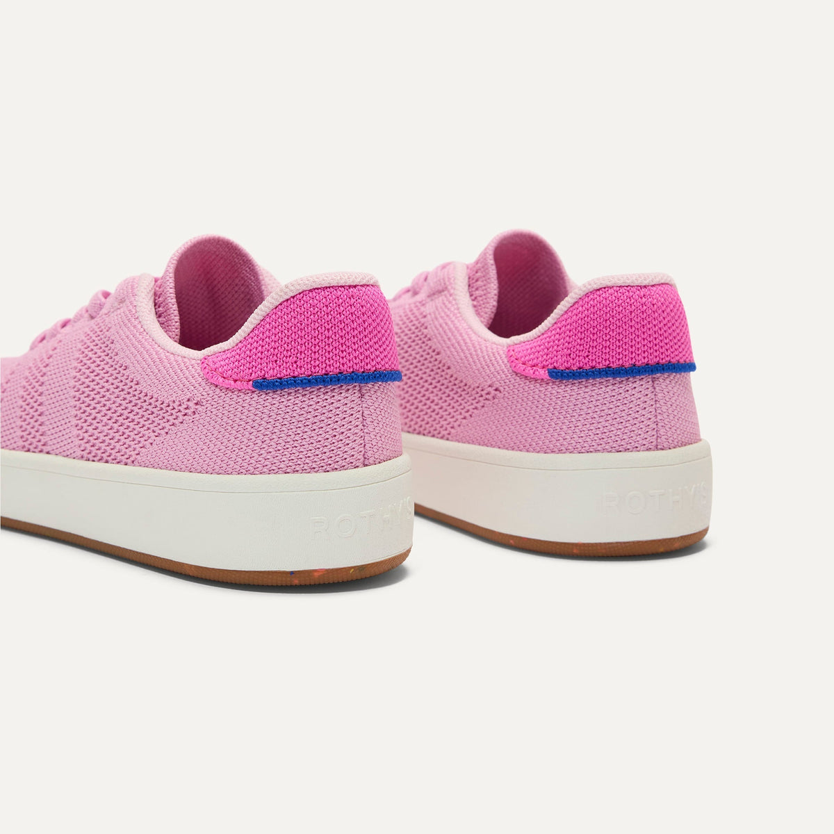 Close up of the heel of The Kids Stretch Sneaker in Bubble Pop, with Rothy's signature blue halo.